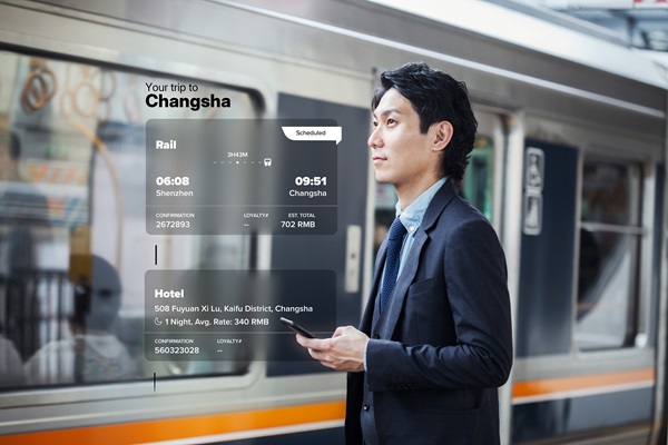 Man at train station with travel itinerary overlay.