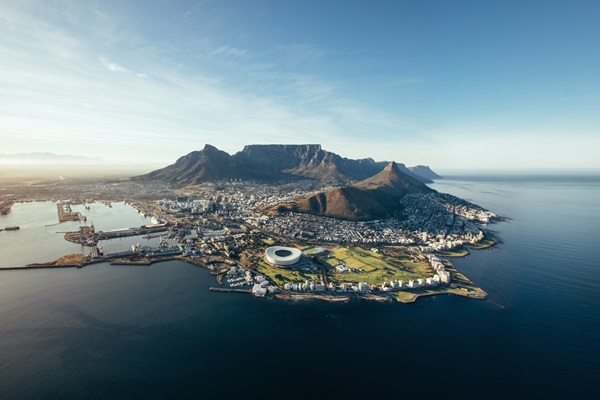 Aerial view of Cape Town, mountains, and coastline.