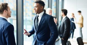 Professionals conversing at a modern business event.